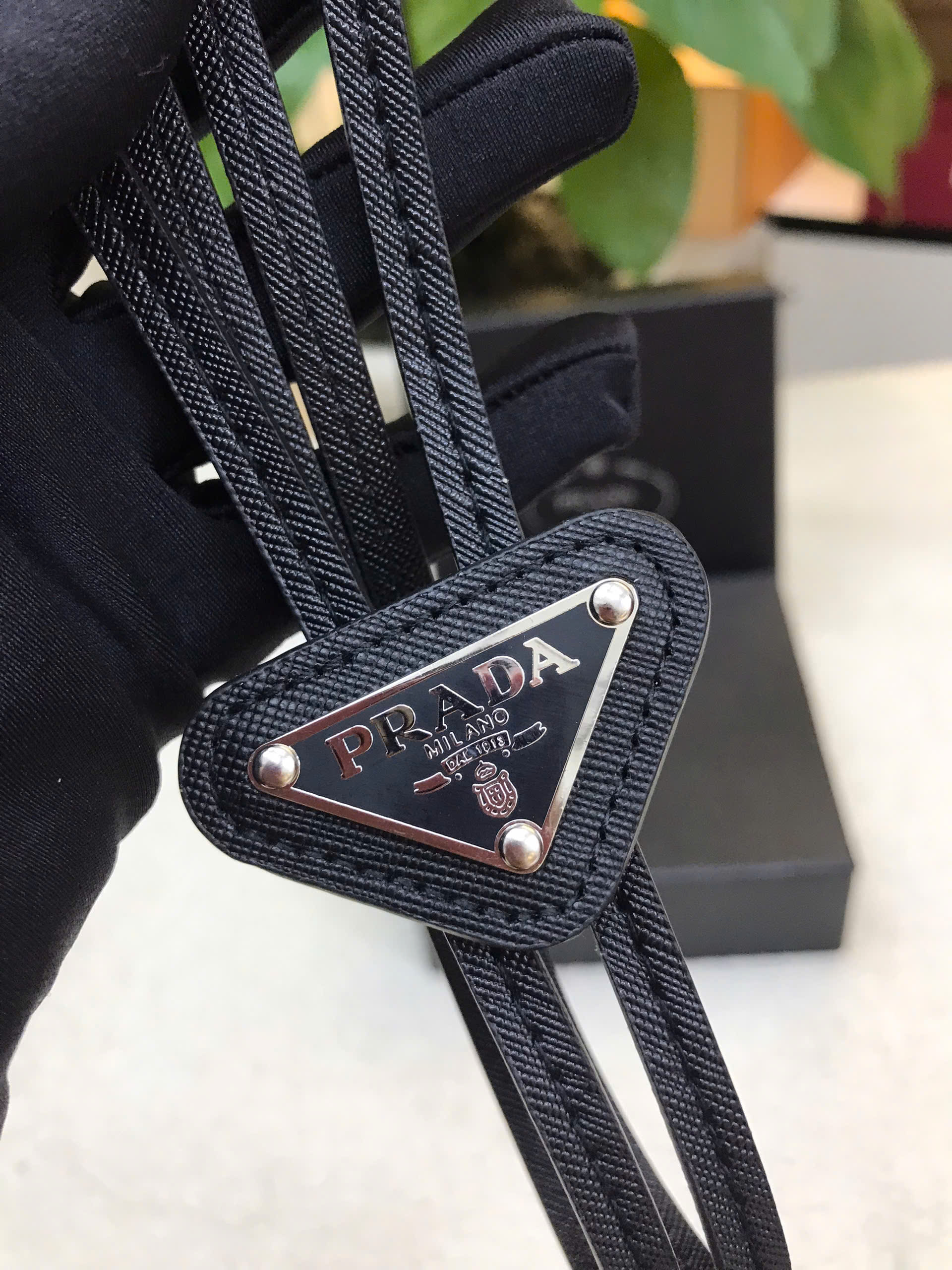 Cà Vạt Prada Brushed Leather Bolo Tie Black Siêu Cấp Màu Đen